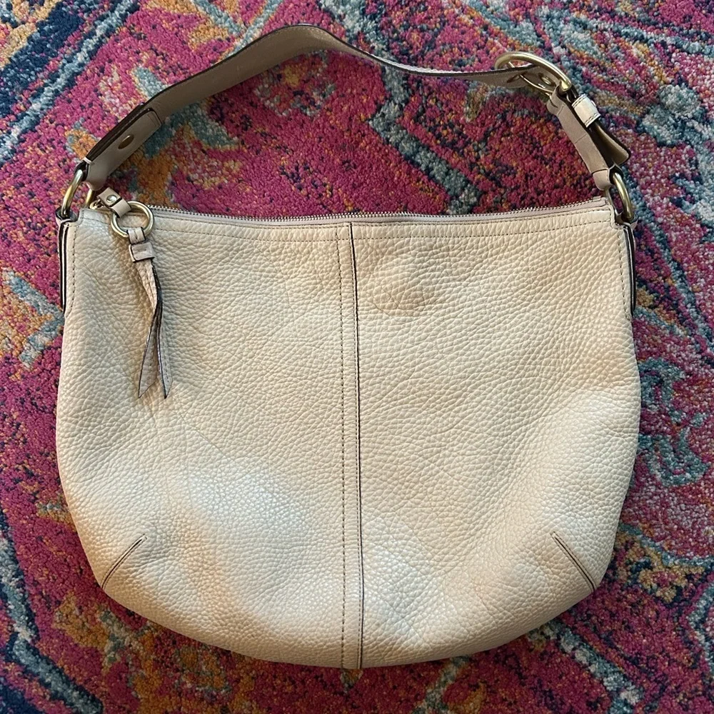 Coach | Women’s cream pebbled leather round bottom over the shoulder purse, OS